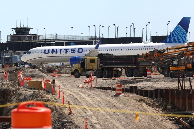 A United Airlines jet near construction of the new Concourse D at O'Hare International Airport in Chicago, April 23, 2026. O'Hare's operating revenue increased $108.7 million. (Antonio Perez/Chicago Tribune)