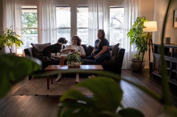 How to talk to your children about money 9 Cash Edgar, 17, sits next to his mother Jamie Corum...