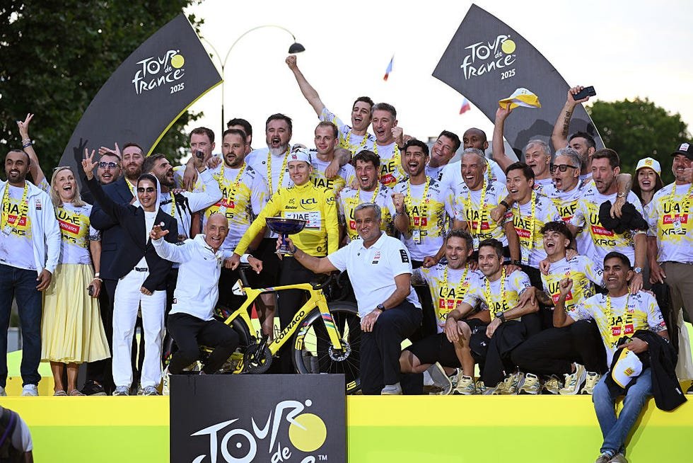 The UAE Team Emirates celebrates the final podium of the Tour de France together.