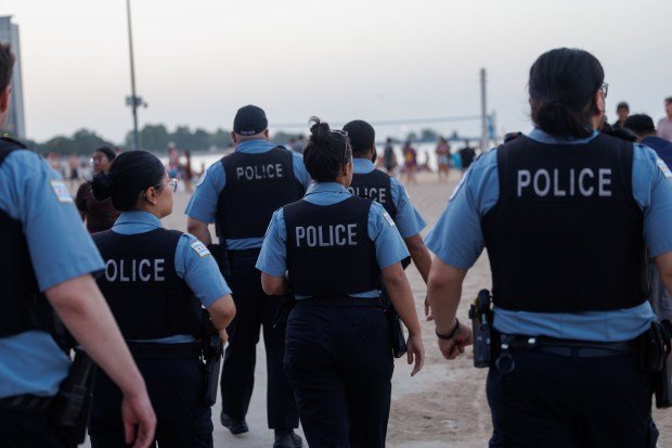 Chicago police walk along the Lakefront Trail while responding to a report of a fight at Oak Street Beach on June 30, 2026. (Armando L. Sanchez/Chicago Tribune)