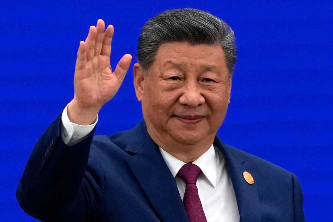 Chinese President Xi Jinping waves as he arrives for the opening ceremony of the World AI Conference in Shanghai, Friday, July 17, 2026. 