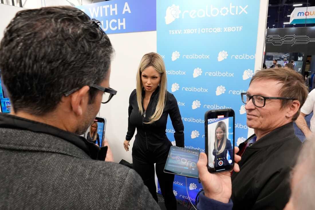 New York school pauses plan to deploy human-like AI robot teacher after backlash: NPR 5 FILE - A Realbotix humanoid robot, center, speaks to attendees at a Realbotix booth during the CES technology trade show Jan. 8, 2025, in Las Vegas.