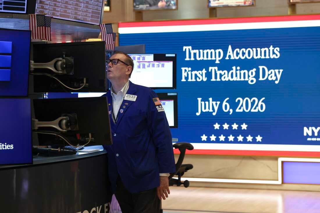 A trader rings the opening bell of the New York Stock Exchange (NYSE) from the Oval Office in New York on July 6, 2026, to celebrate the first day of trading for the Trump accounts