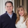 Michael and Susan Dell pose for photos in New York on November 26th. The couple said it would donate $6.25 billion to fund investment accounts for 25 million U.S. children.