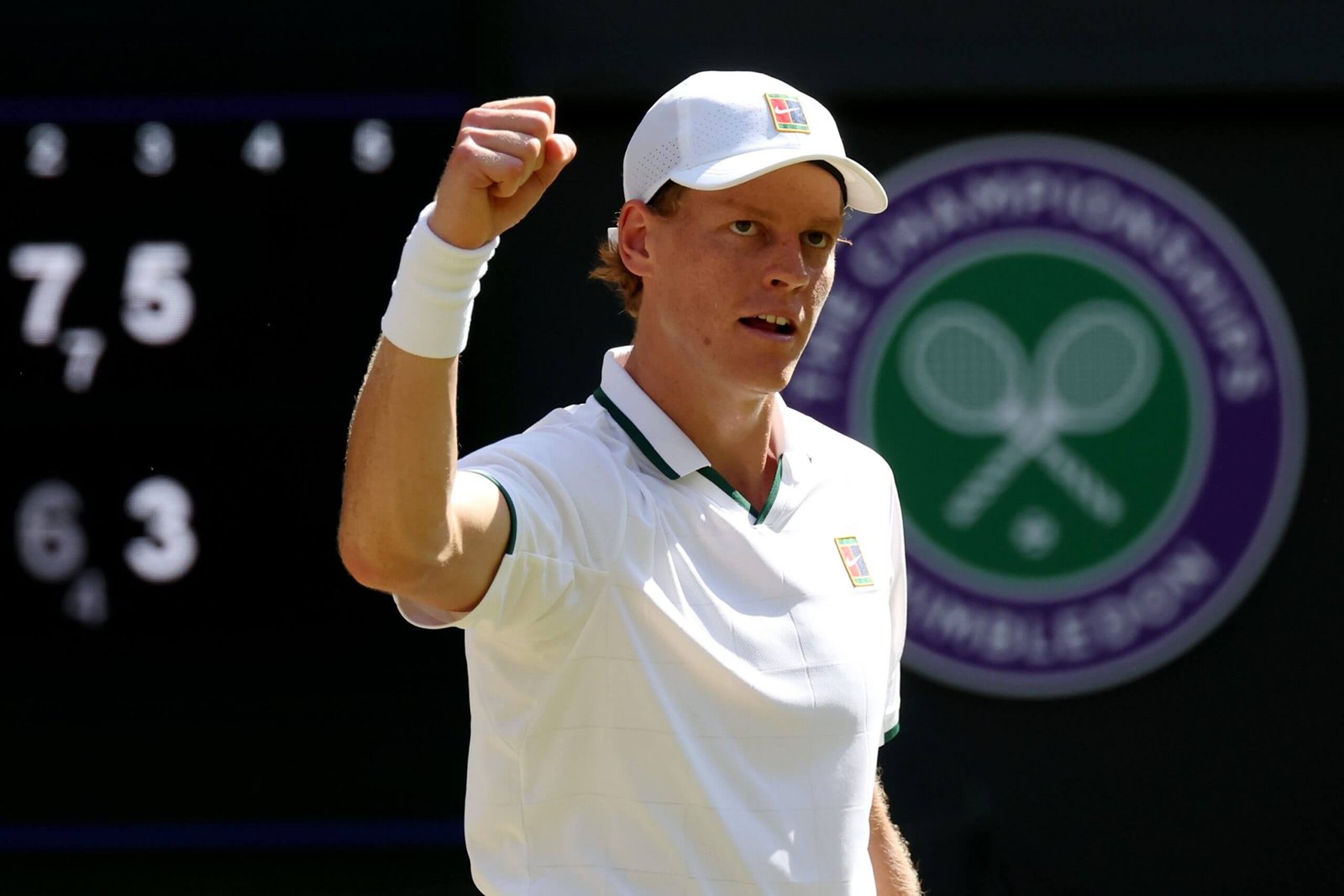 Top tennis players are aiming for the star-studded mixed doubles of the US Open in the fight for prize money 5 Jannik Sinner raises his fist in the air in front of the Wimbledon logo.