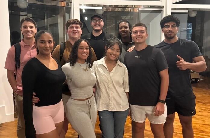 A group of students in an indoor area